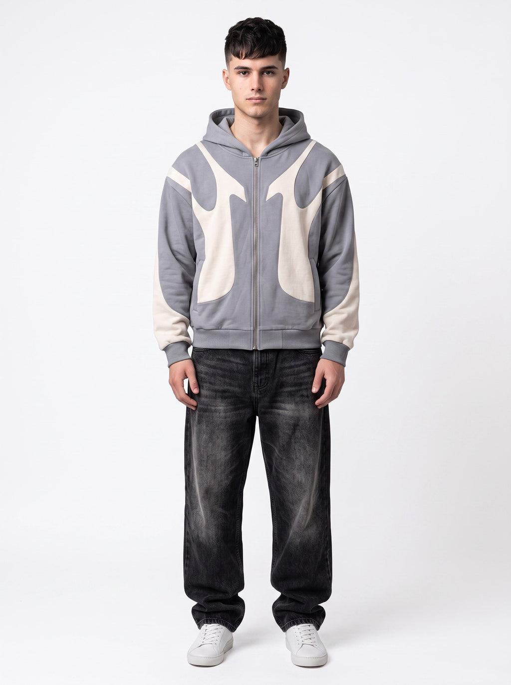 Model wearing Y2K Avenue grey and cream flame panel zip-up hoodie paired with black baggy jeans