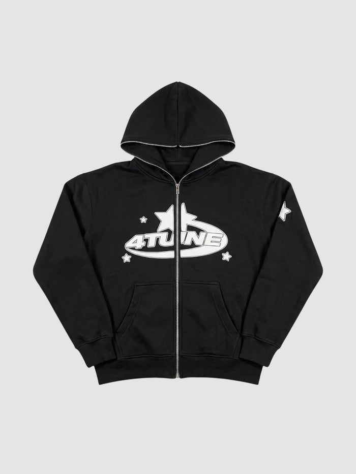 Hoodie zippé noir avec graphisme étoile et lettrage blancs, doublure polaire et capuche.