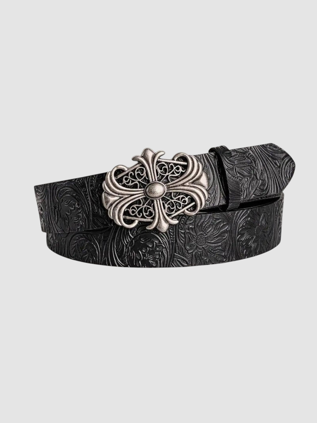 Ceinture noire en cuir synthétique gravée de motifs floraux avec boucle croix argentée ornementée, style gothique rock.