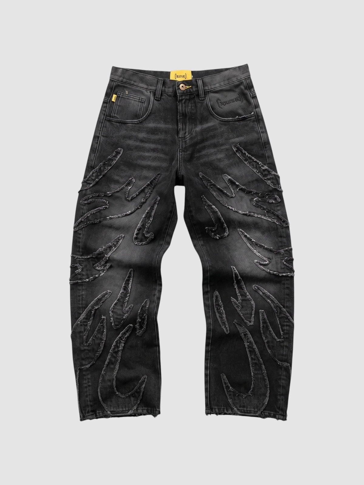 Jean baggy noir en denim avec appliqués flammes à bord brut et coupe jambe large.