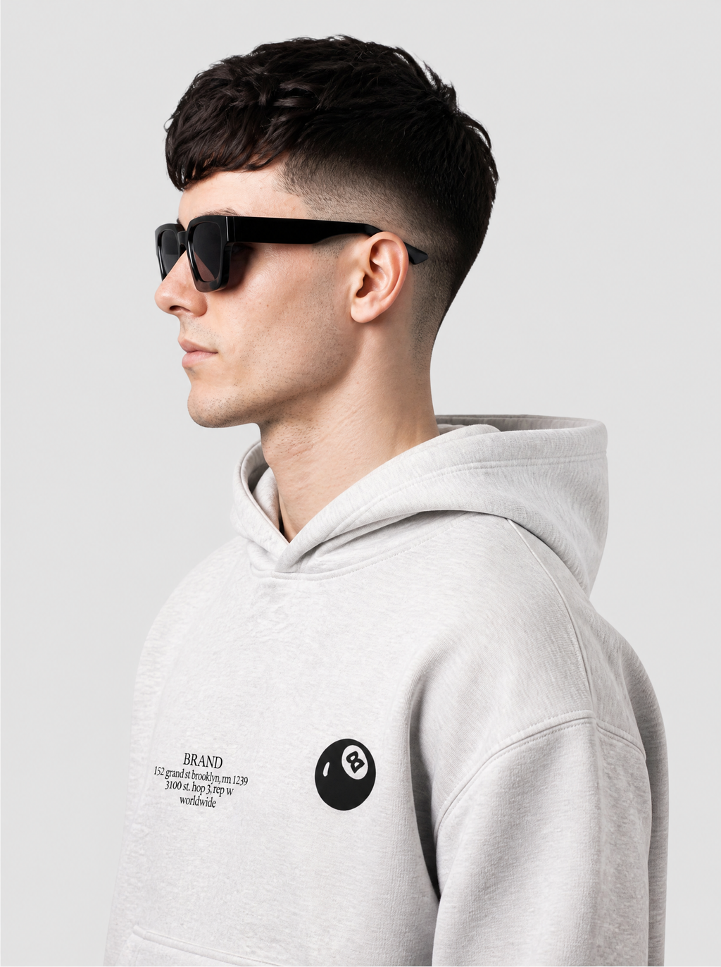 Autre vue | Profil des lunettes rectangulaires noires à monture épaisse et branches larges, portées par un homme en hoodie gris chiné | Variante : Noir
