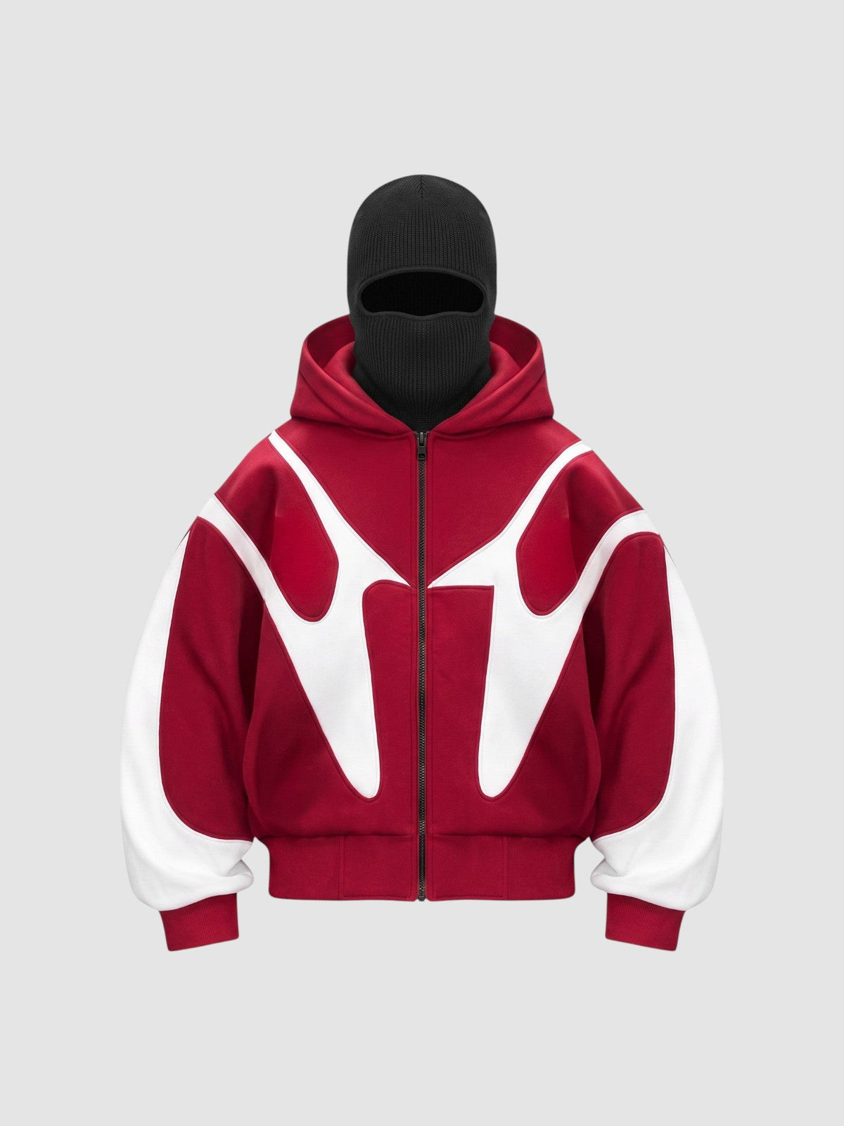 Veste streetwear oversize rouge et blanche avec cagoule noire intégrée et doublure polaire.