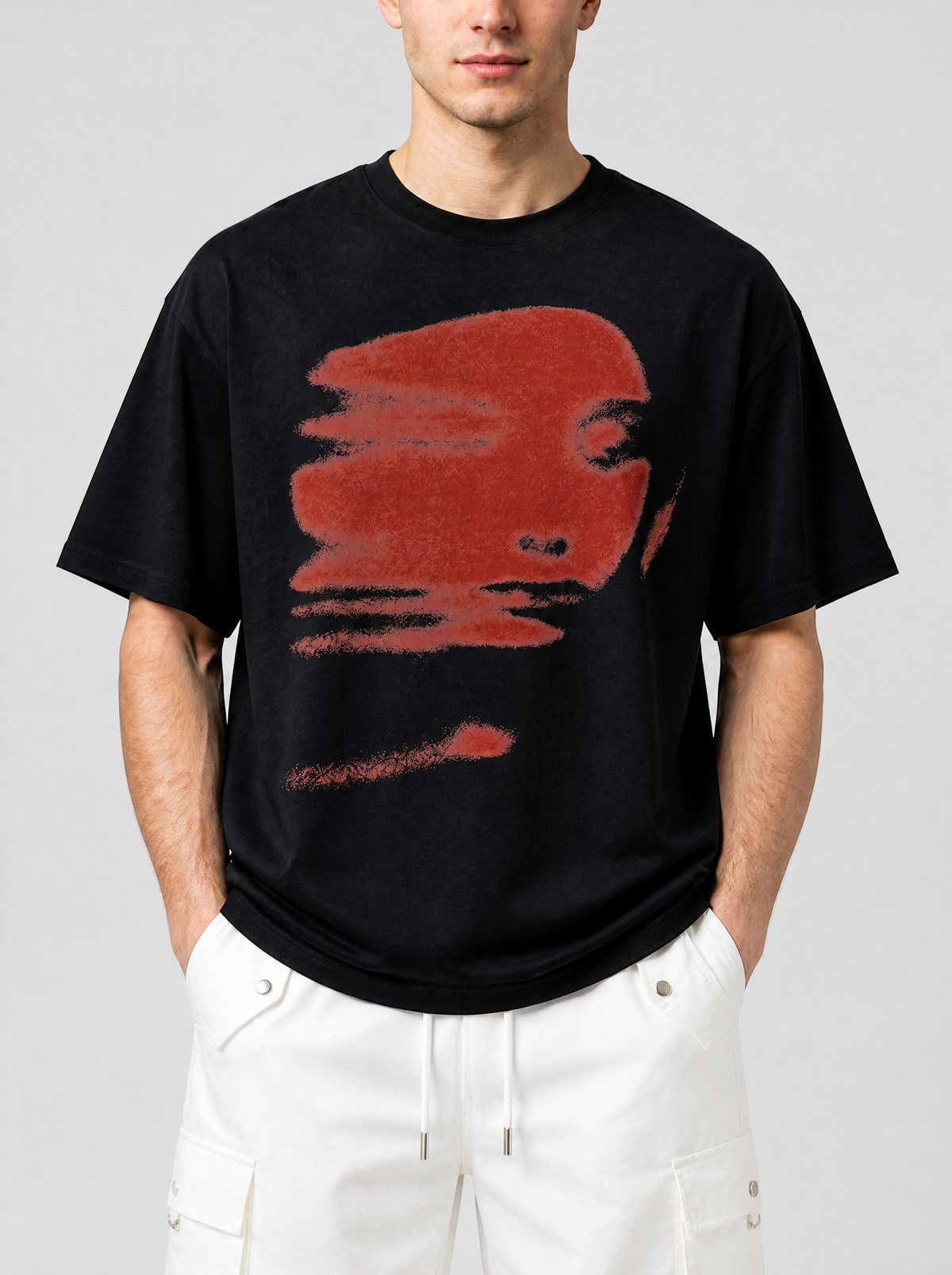 Photo détail | Gros plan sur l'imprimé du t-shirt noir : visage rouge granuleux étiré à l'horizontale, œil et nez nets | Variante : Noir