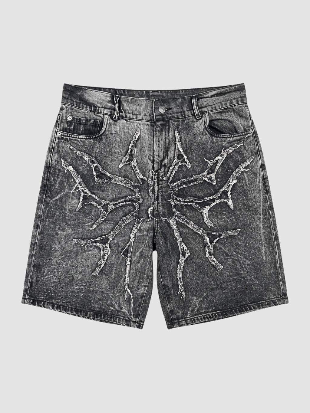 Y2K Avenue acid wash black denim jorts featuring a distressed thorny star appliqué with raw frayed edges.