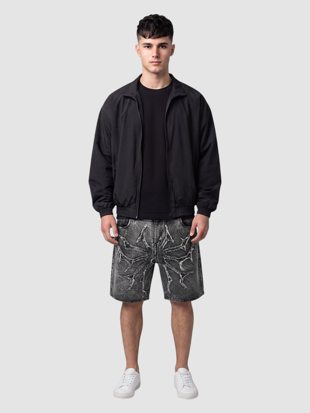 Y2K Avenue acid wash denim jorts featuring thorny star applique and raw frayed hems worn by a male model