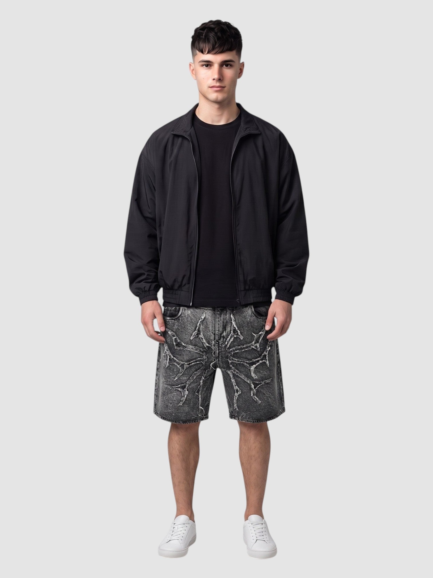 Y2K Avenue acid wash denim jorts featuring thorny star applique and raw frayed hems worn by a male model