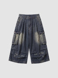 Y2K Avenue baggy cargo denim shorts in a faded blue wash with large side pockets and a high-waisted pleated fit.
