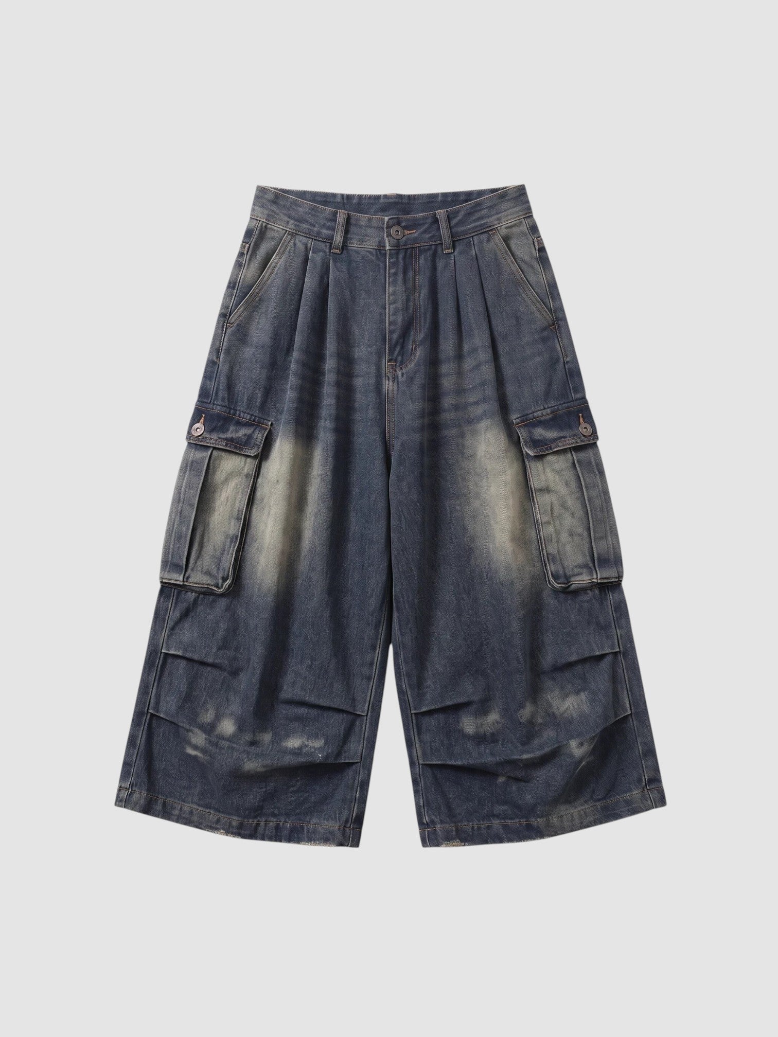 Y2K Avenue baggy cargo denim shorts in a faded blue wash with large side pockets and a high-waisted pleated fit.
