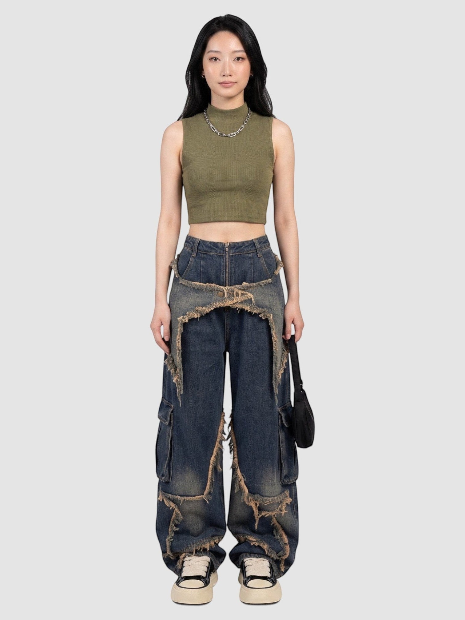 Model wearing Y2K Avenue baggy indigo cargo jeans with frayed denim overlays and a high-waisted fit