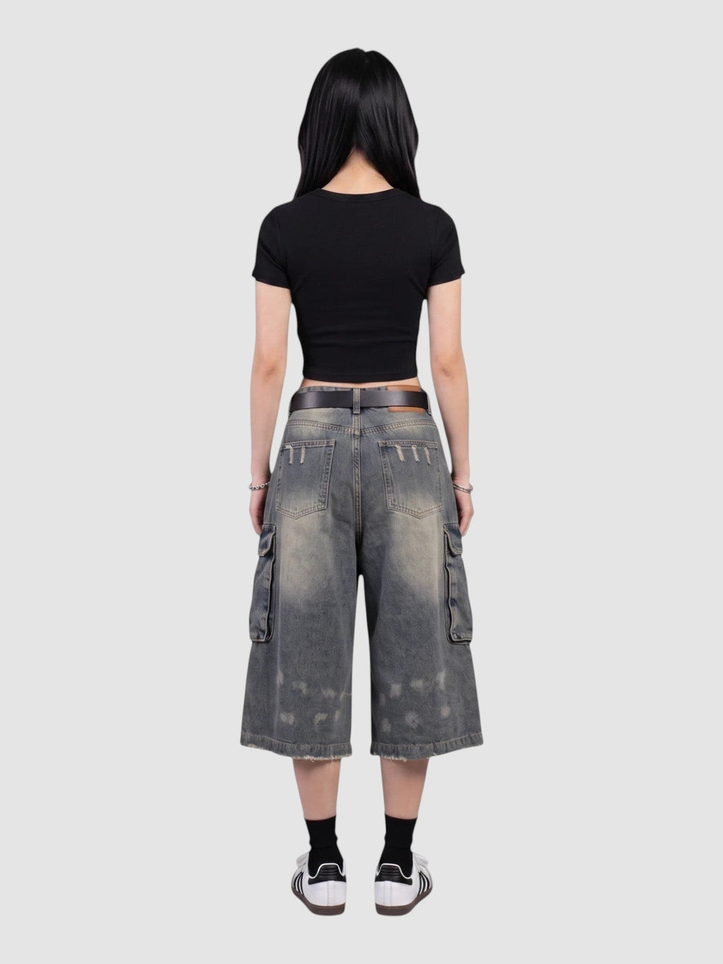 Y2K Avenue baggy denim cargo shorts with a distressed wash, side pockets, and high-waisted fit, back view.