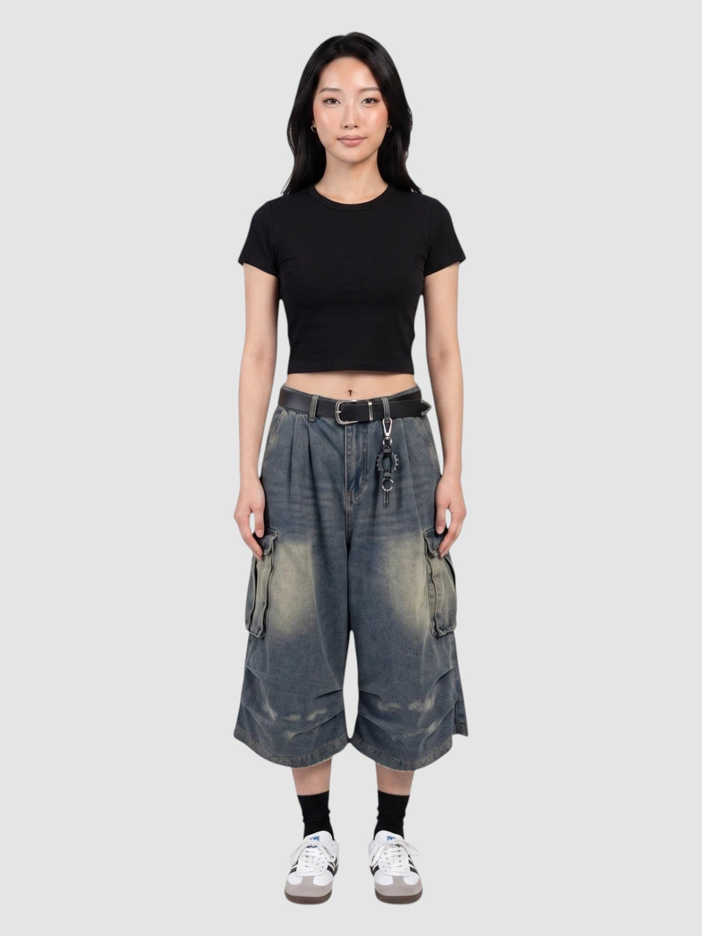 Y2K Avenue baggy denim cargo shorts with a high-waisted, wide-leg fit, featuring side flap pockets and faded wash.