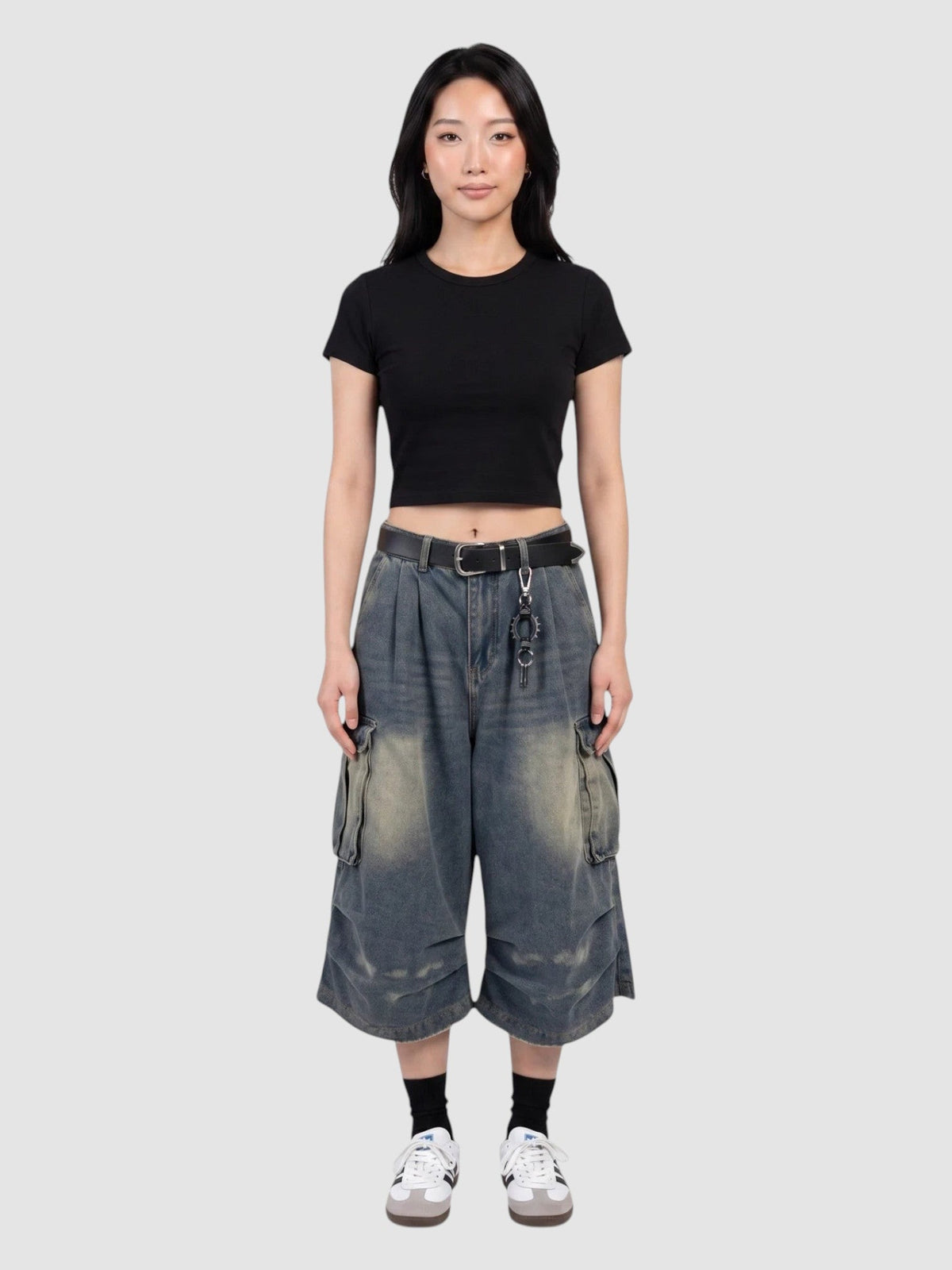 Y2K Avenue baggy denim cargo shorts with a high-waisted, wide-leg fit, featuring side flap pockets and faded wash.
