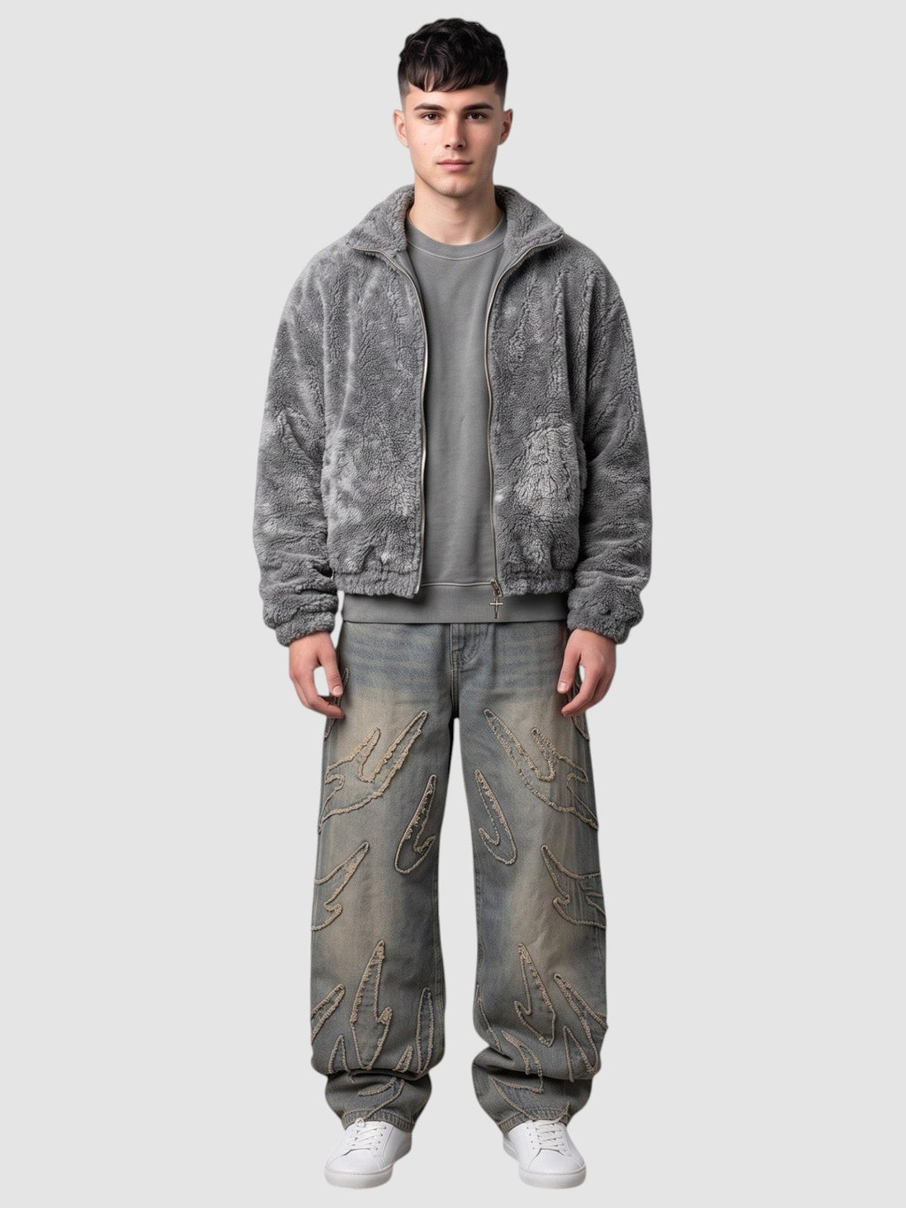 Y2K Avenue baggy grey denim jeans featuring raw-edge flame appliqués, worn by a model with a grey fleece jacket.
