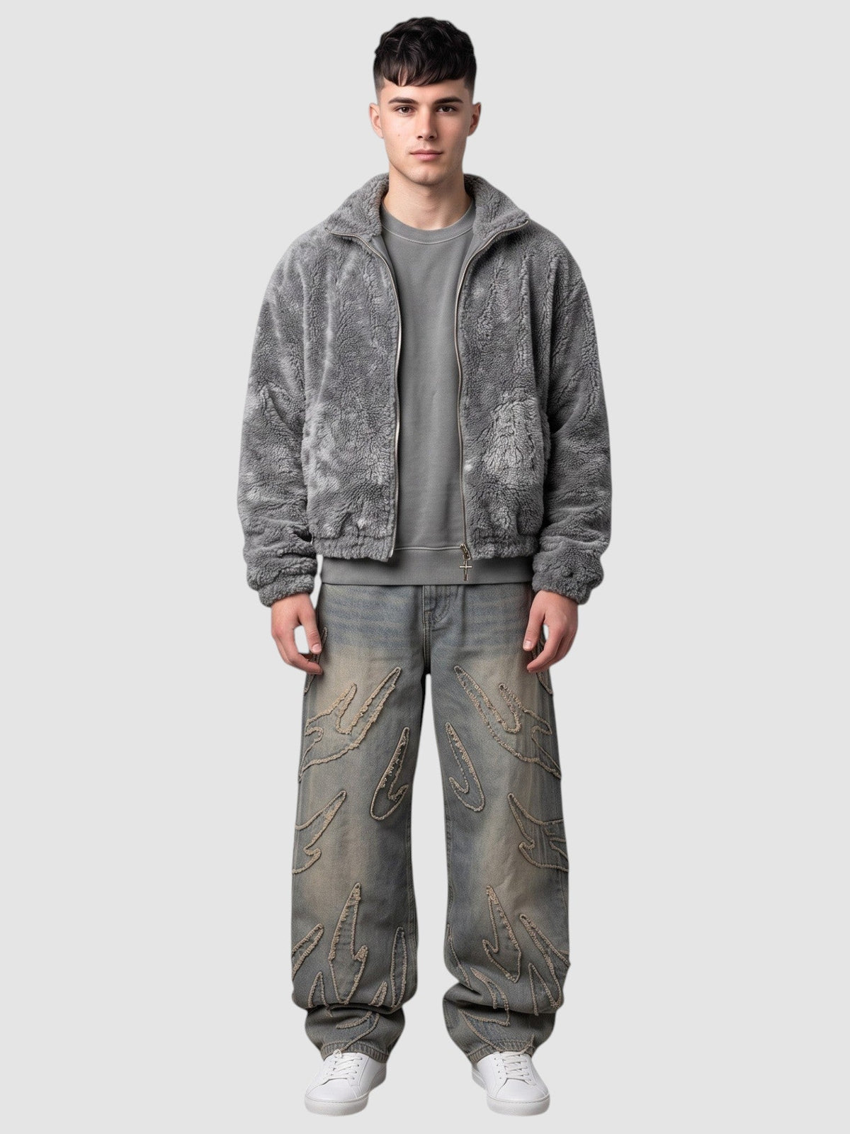 Y2K Avenue baggy grey denim jeans featuring raw-edge flame appliqués, worn by a model with a grey fleece jacket.