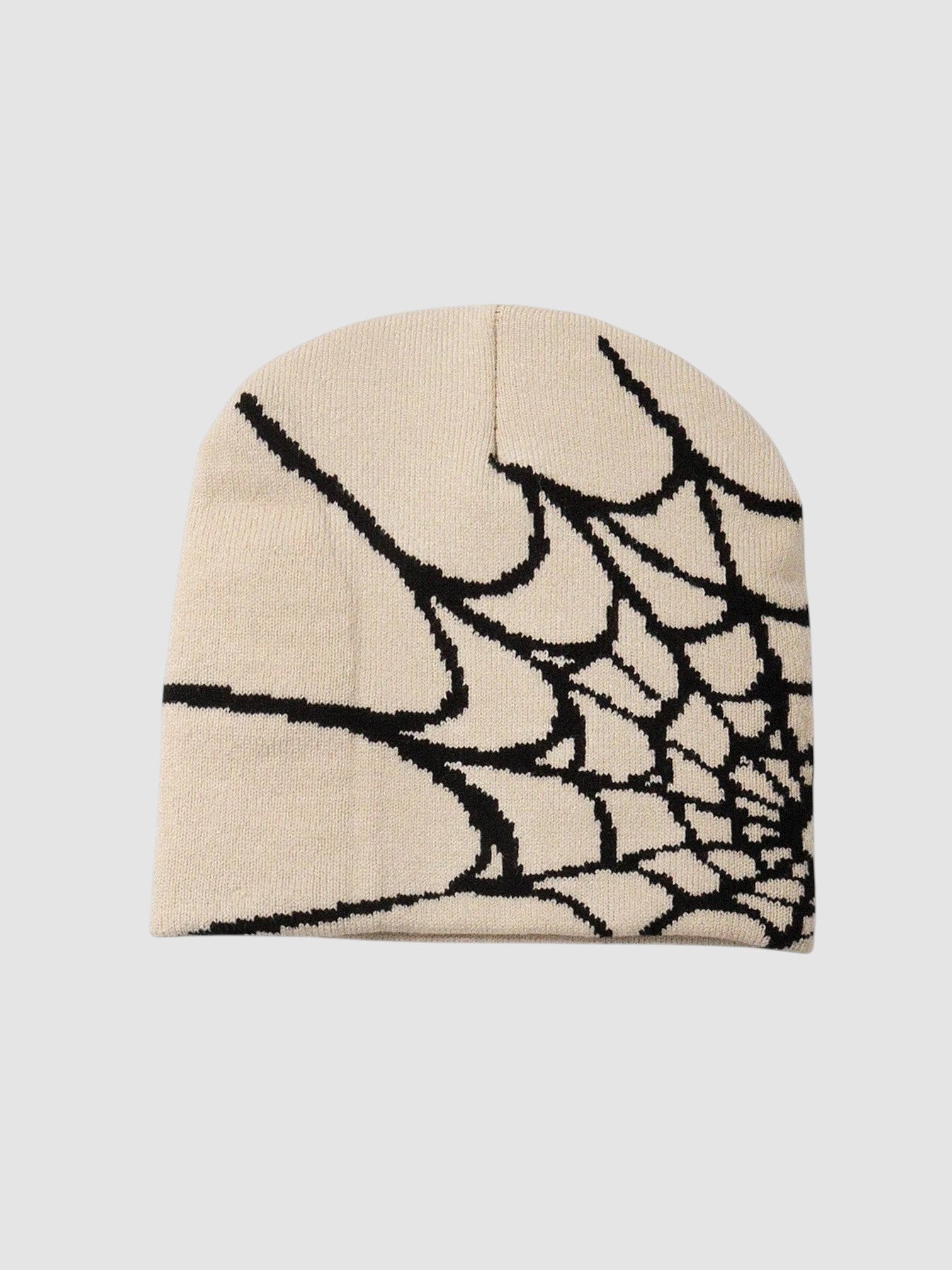 Y2K Avenue beige beanie featuring a bold black spider web graphic pattern in a lightweight knit fabric