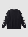 Y2K AVENUE black knit sweater featuring a white 3D-effect bone pattern on the sleeves and a crew neck design.