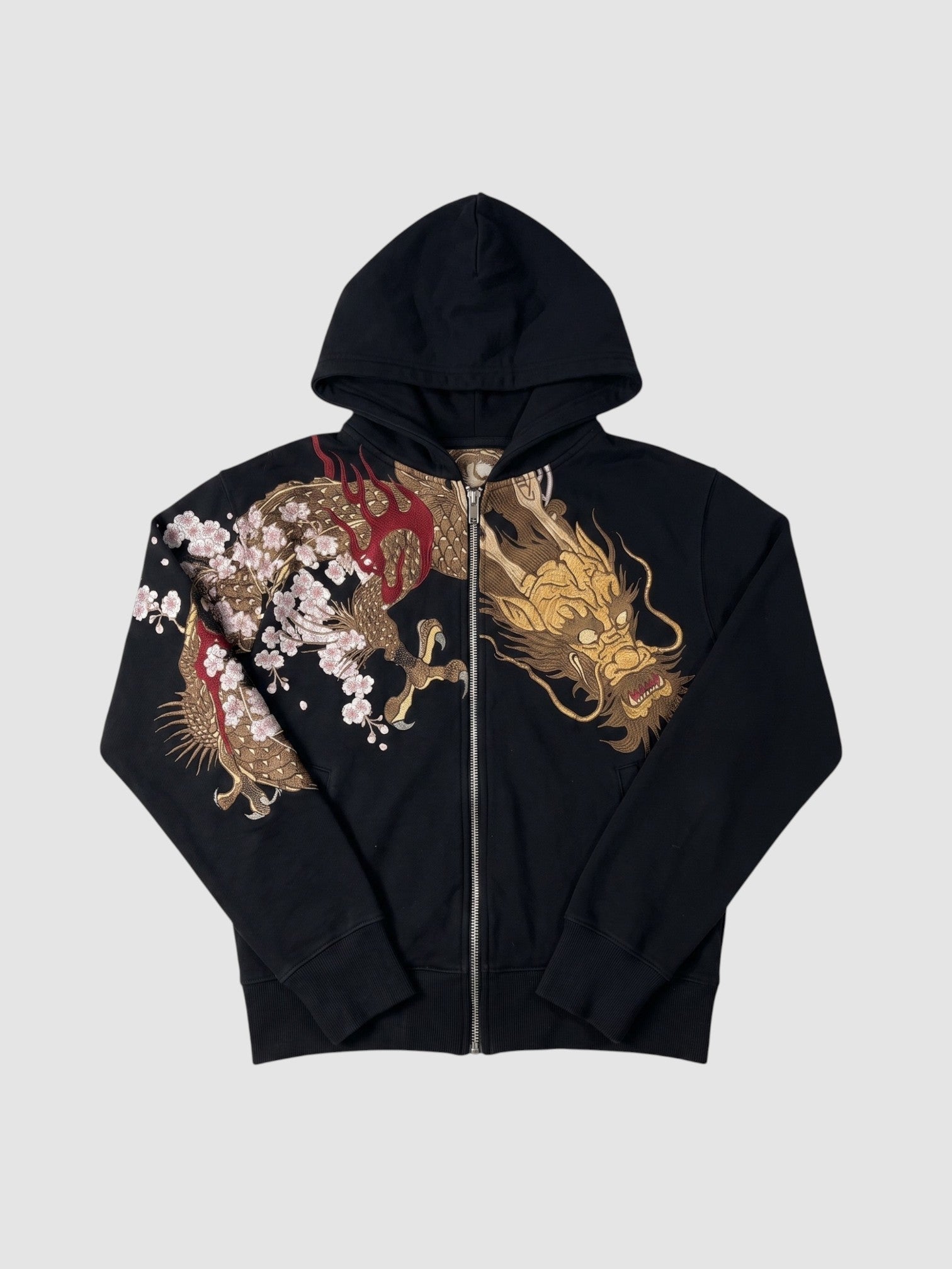 Y2K Avenue black zip-up hoodie featuring a detailed gold dragon and cherry blossom print across the chest and sleeve.