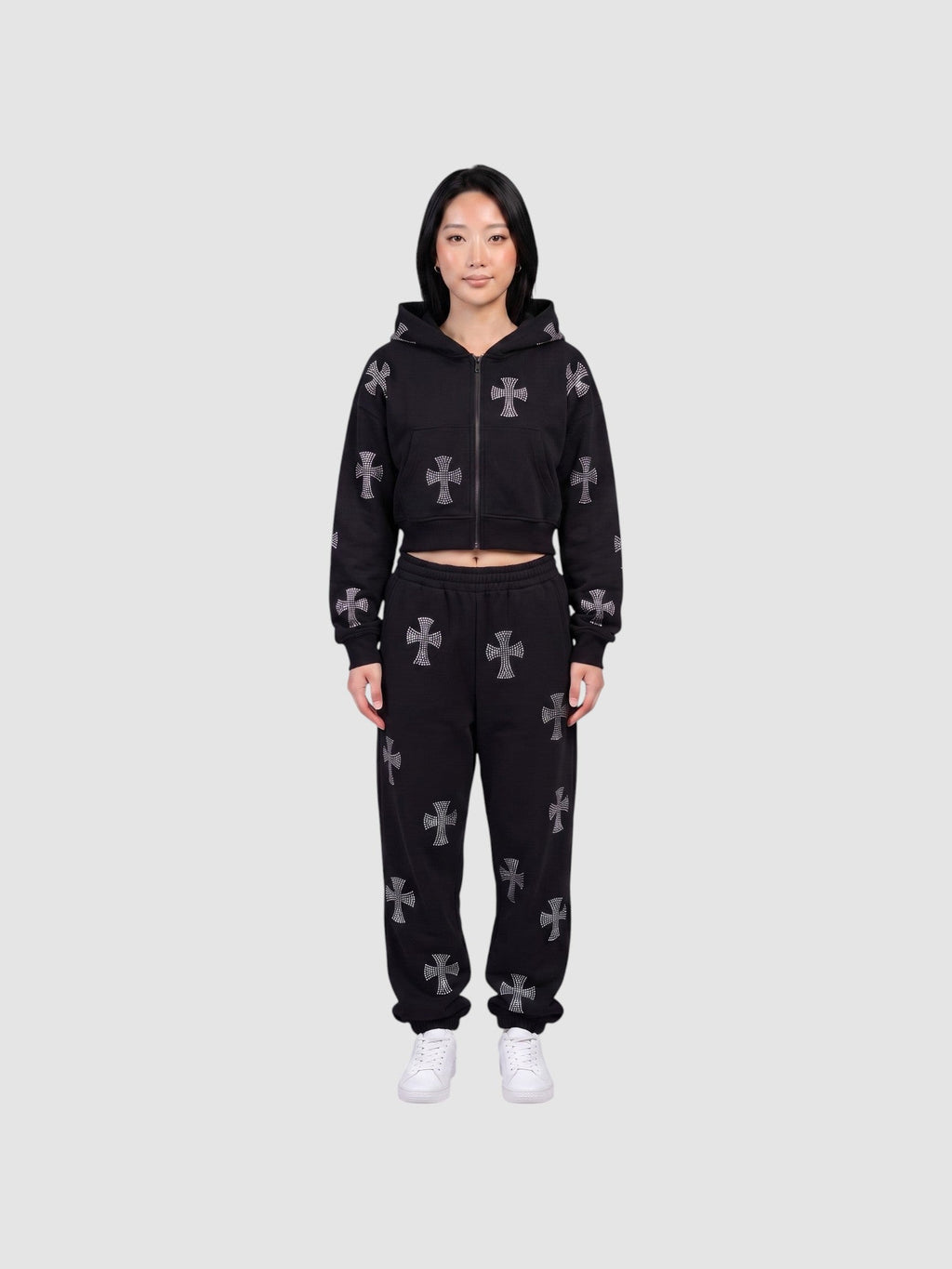 Y2K Avenue black gothic zip-up hoodie and matching sweatpants set with grey cross patterns worn by a model