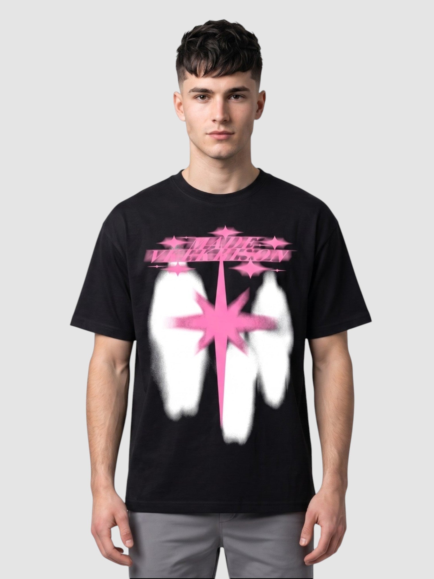 Y2K Avenue black cotton t-shirt with a neon pink star and white silhouette graphic print worn by a male model