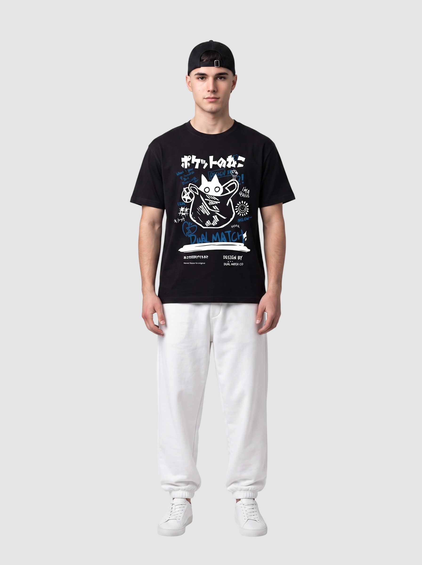 Y2K Avenue black unisex t-shirt with white and blue Japanese cat graffiti print, worn by a man with white joggers