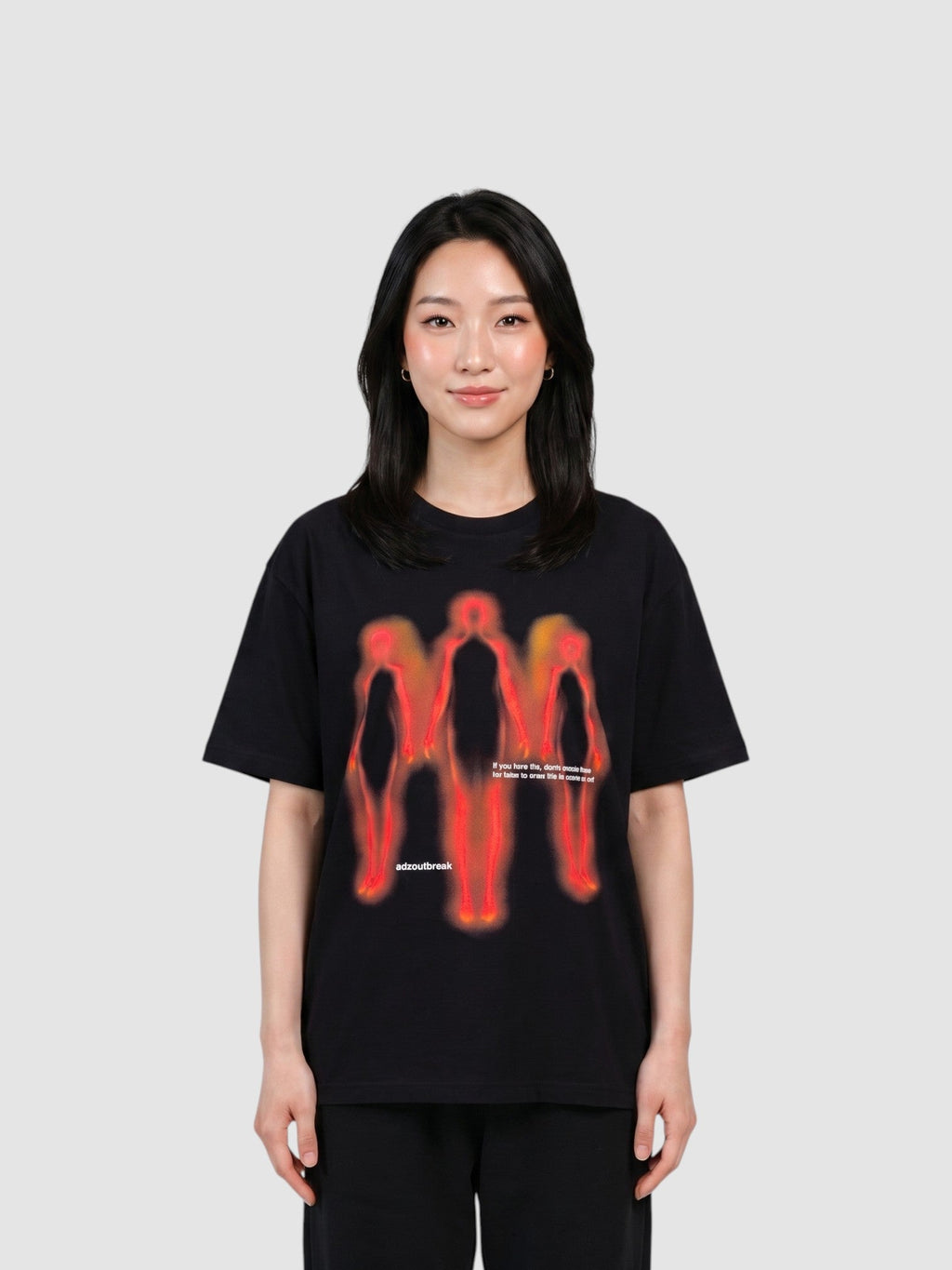 Y2K Avenue black oversized cotton t-shirt featuring a red and orange thermal-style human silhouette graphic print.