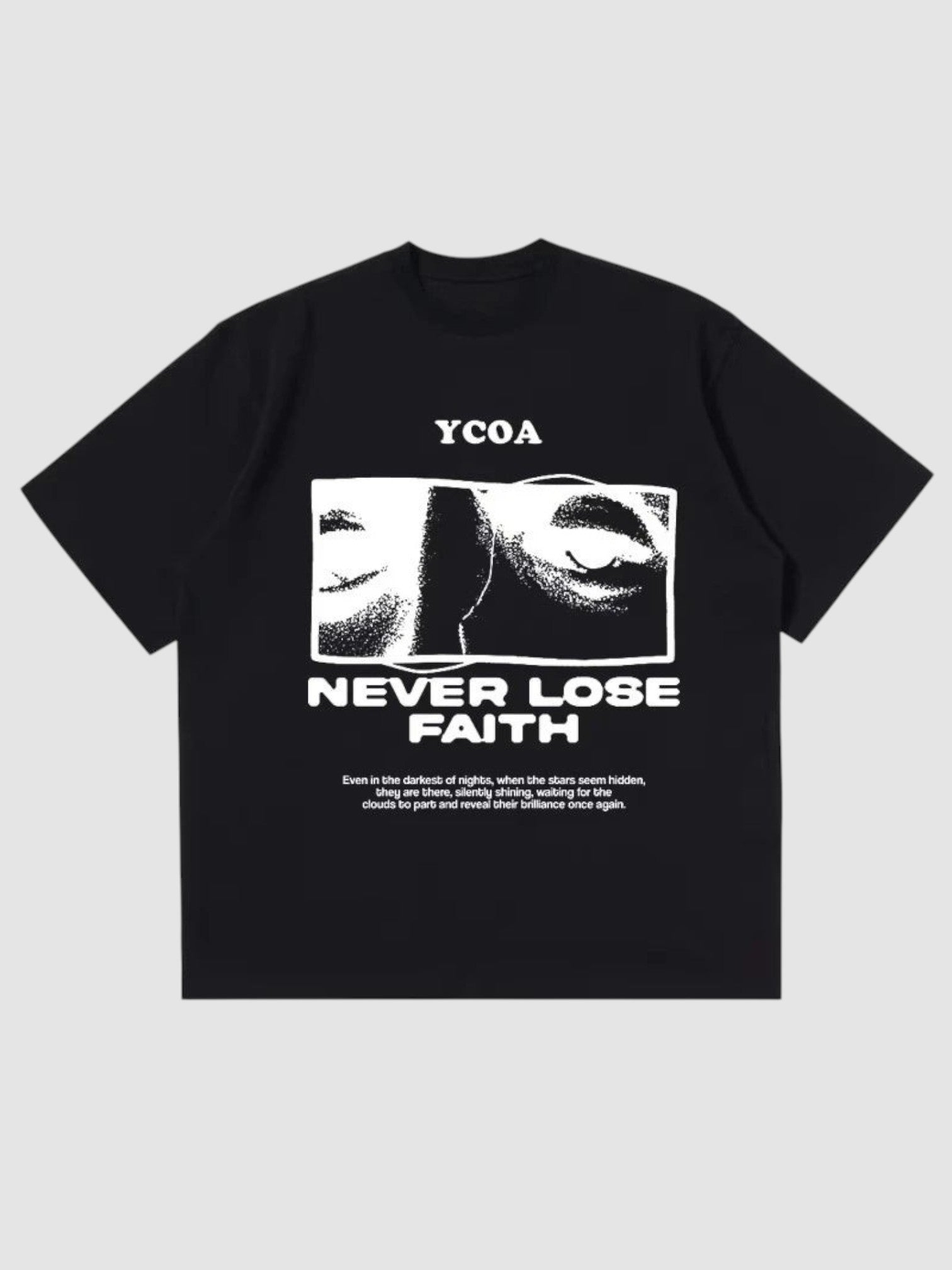 Y2K Avenue black oversized t-shirt featuring a white graphic print of eyes and the text Never Lose Faith