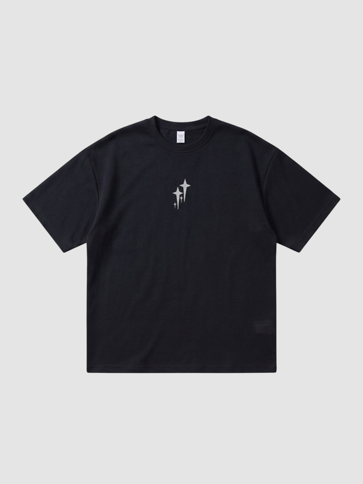 Y2K Avenue black oversized t-shirt with chrome star graphic on chest, featuring a ribbed crew neck and drop shoulders.