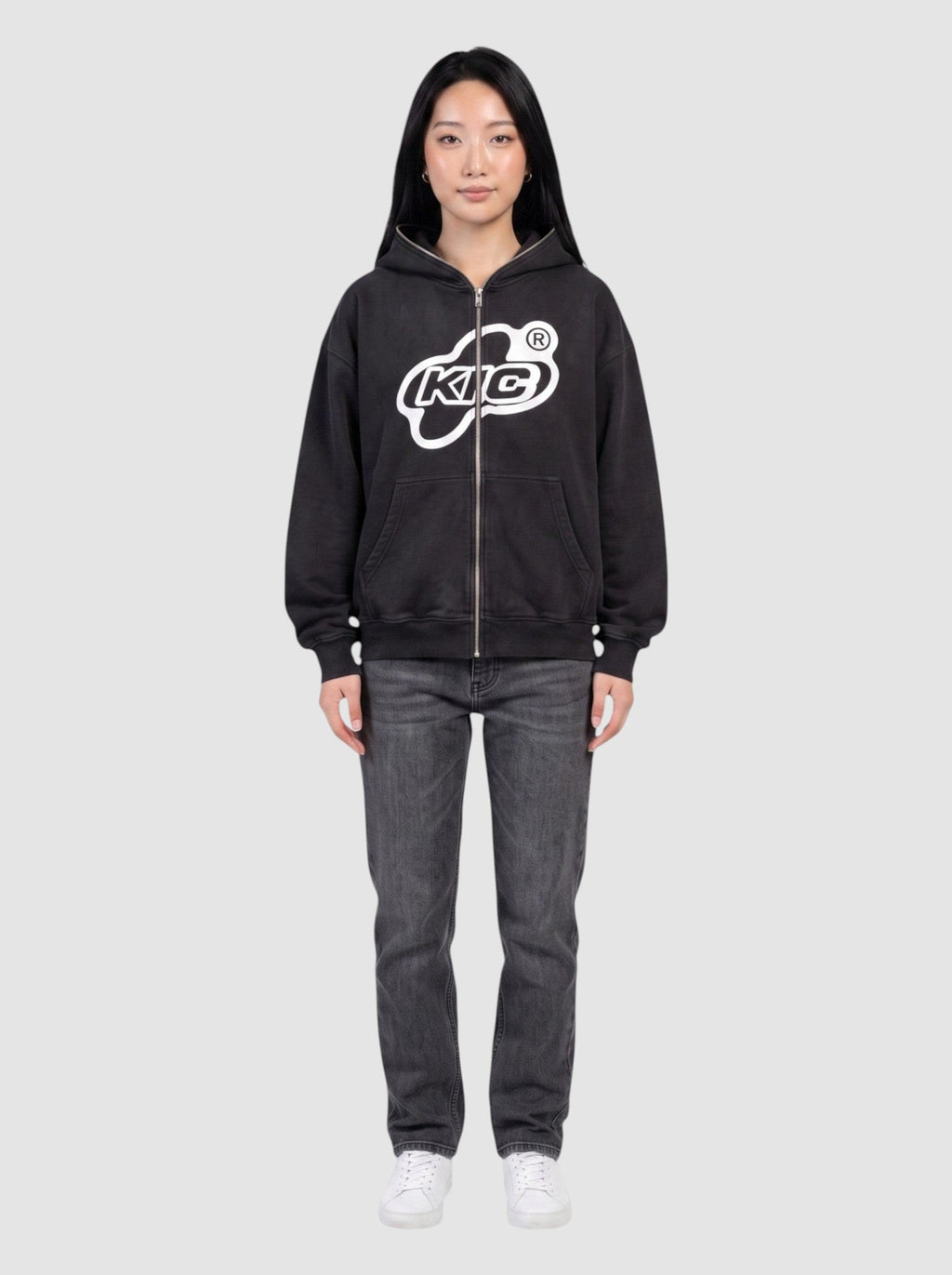 Y2K Avenue black oversized zip-up hoodie with white bubble logo and contrast piping on a model