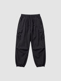 Y2K Avenue black parachute cargo pants with a loose fit, elastic drawstring waist, and side flap pockets.