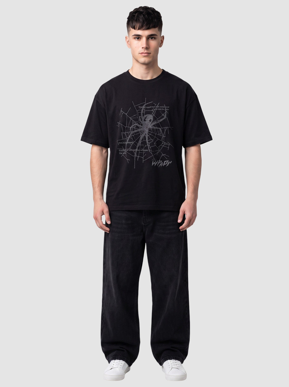 Y2K Avenue black oversized t-shirt with a grey spider web graphic, gothic lettering, and a ribbed crew neck.