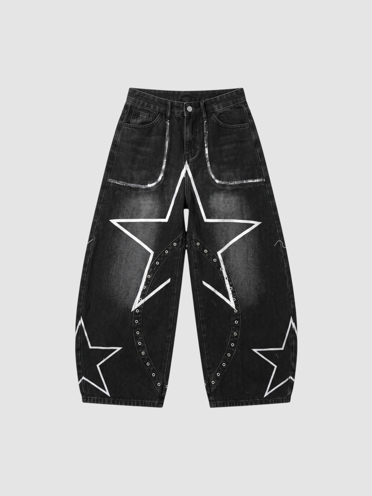 Y2K Avenue black baggy jeans with white hand-drawn star patterns, low-rise waist, and metallic eyelet detailing.