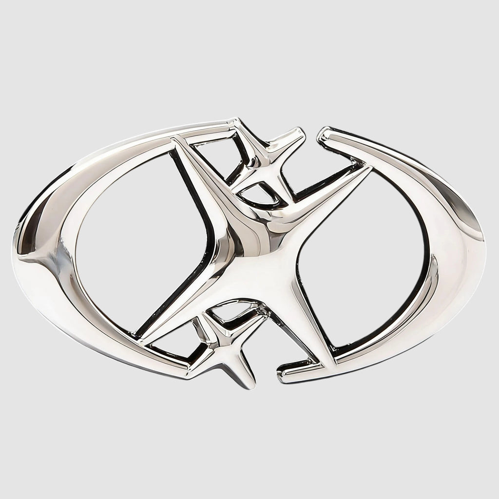 Y2K Avenue black faux leather belt featuring a shiny silver star-shaped buckle with curved crescent blade details.