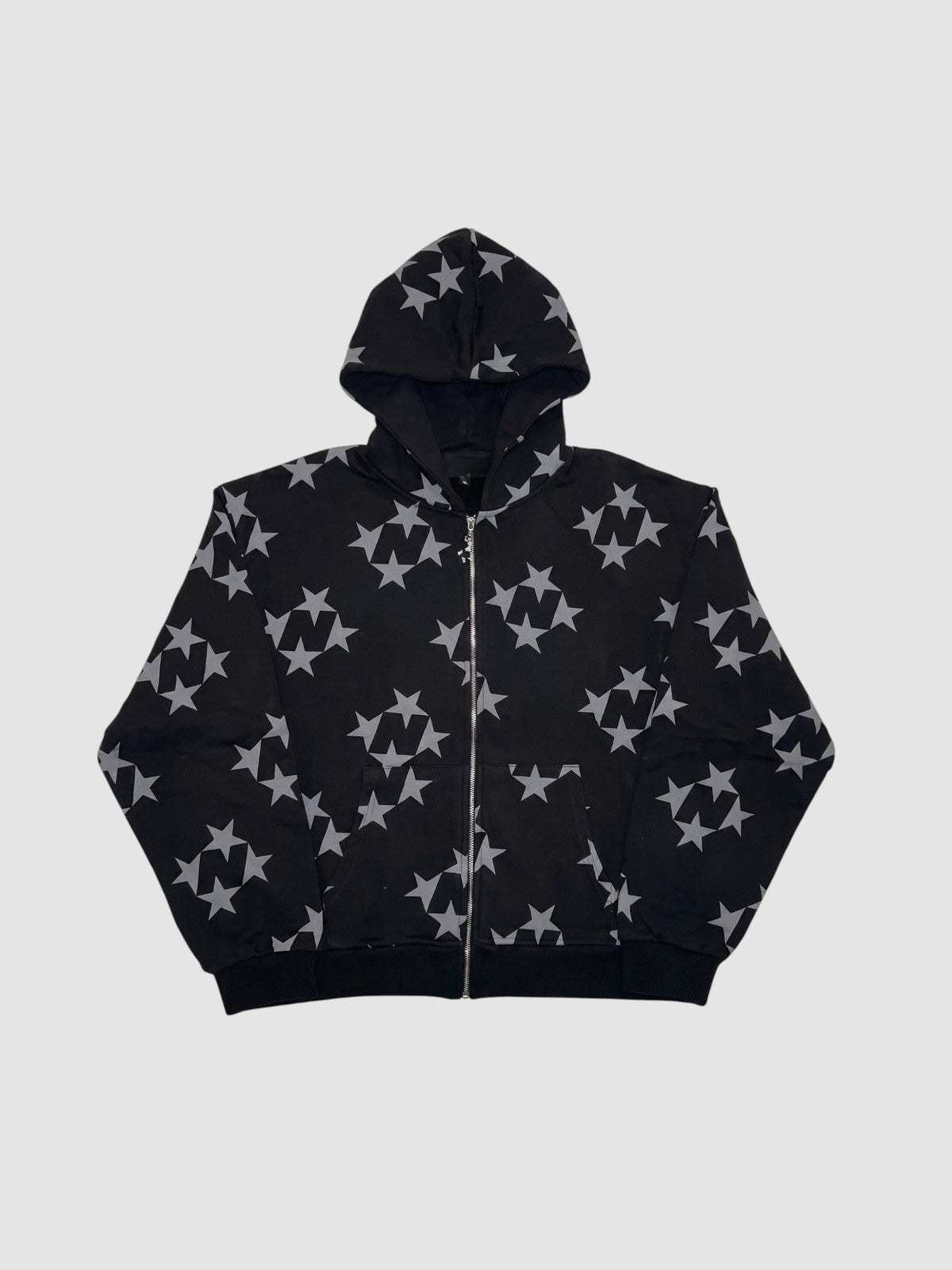 Y2K Avenue black zip-up hoodie featuring an all-over grey star pattern, hood, and front pockets.