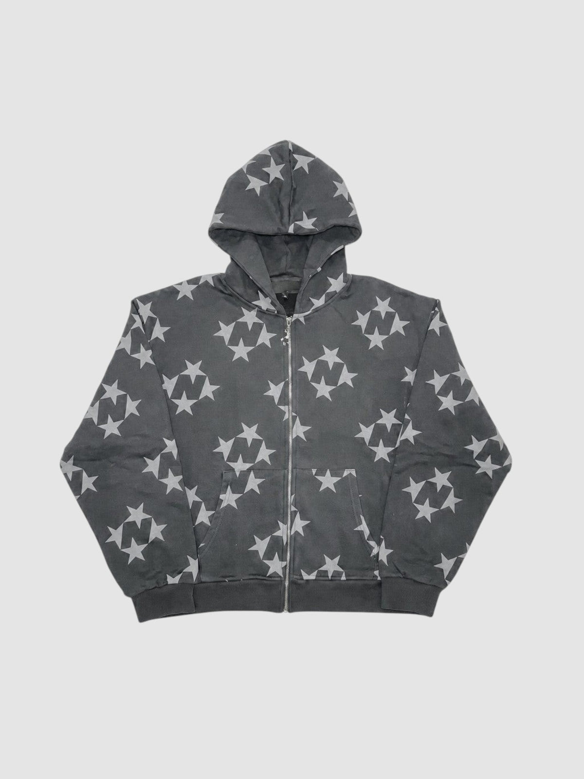 Y2K Avenue black zip-up hoodie featuring an all-over grey star pattern, ribbed cuffs, and a standard fit.