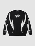 Y2K AVENUE black and white knit sweater featuring an abstract flame motif and a small embroidered chest logo.