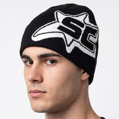 Y2K AVENUE black and white knit beanie with a bold star graphic print worn by a man for casual winter streetwear