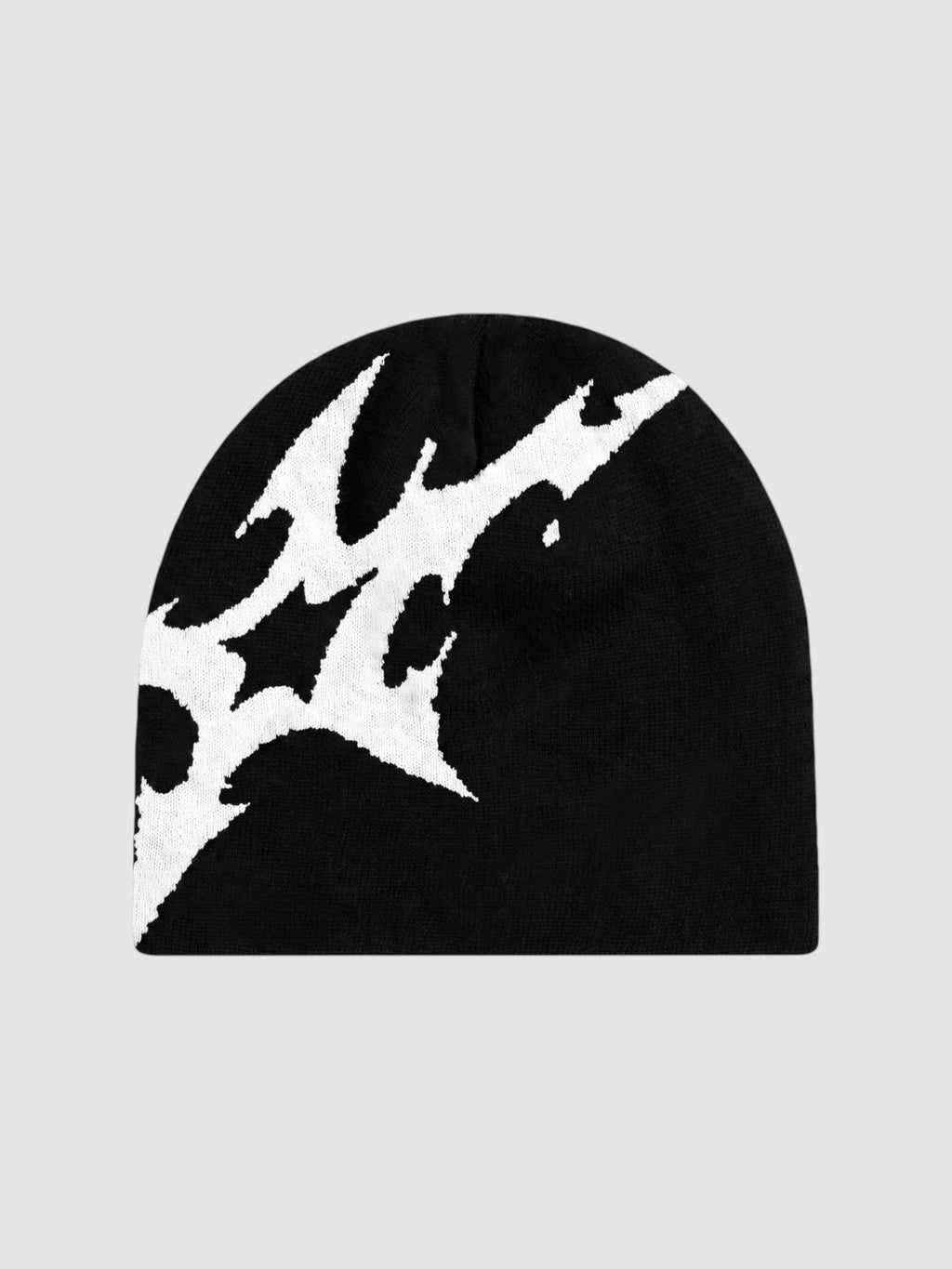 Y2K Avenue black acrylic beanie featuring an asymmetrical white stylized lightning bolt graphic pattern.