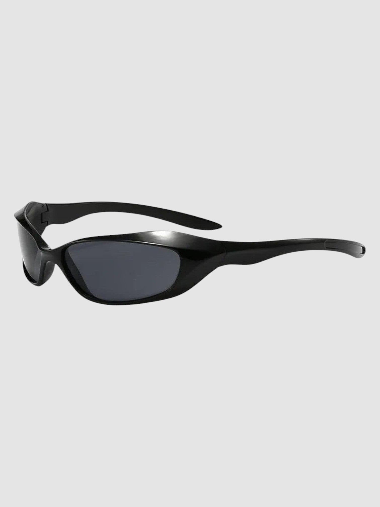 Y2K Avenue black wraparound futuristic sunglasses with dark tinted lenses and a sleek polycarbonate frame