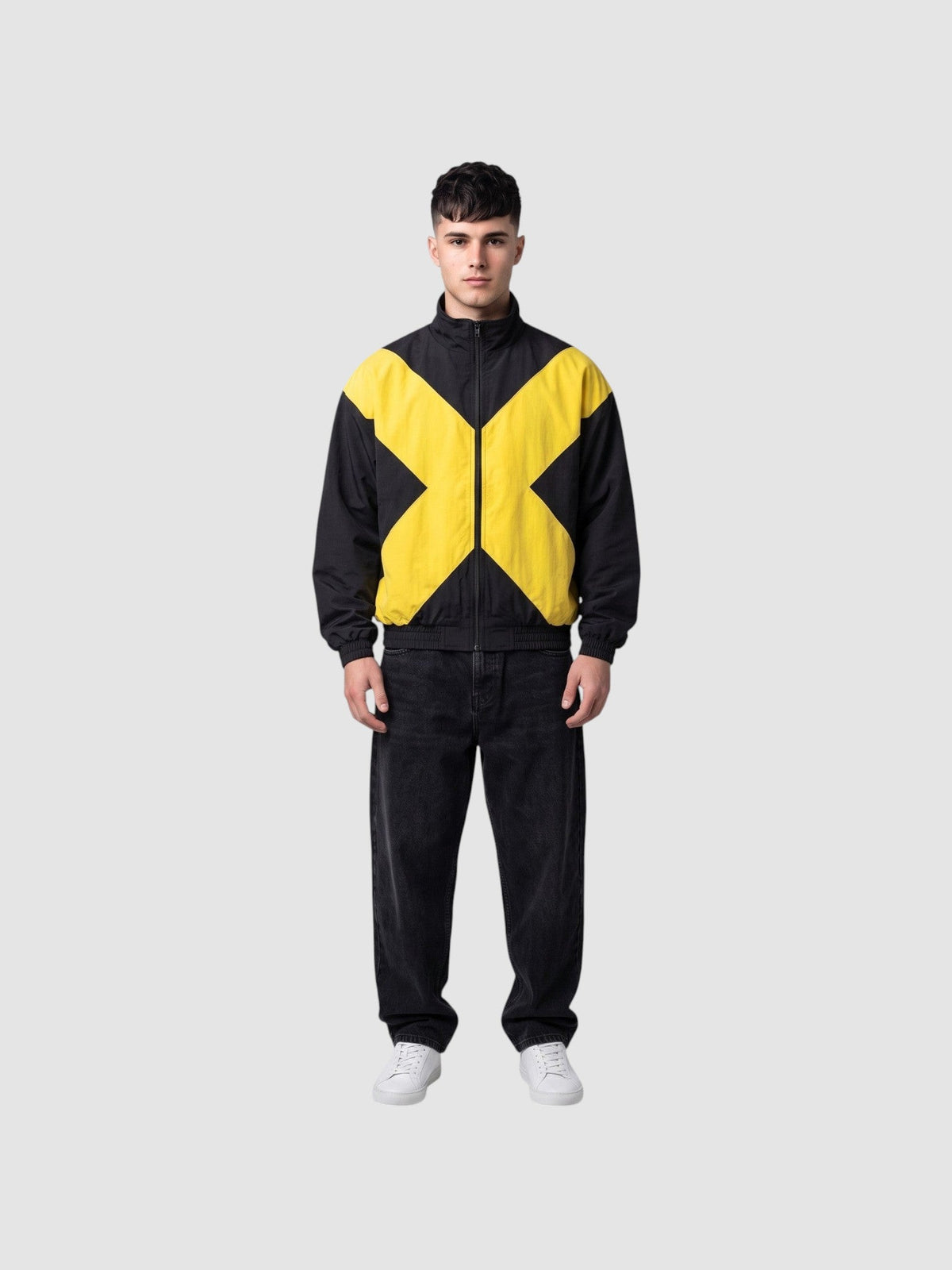 Y2K Avenue black and yellow bomber jacket with a large cross design, high collar, and cotton lining on a male model.