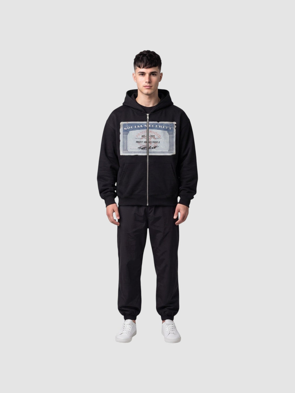 Y2K Avenue black zip-up hoodie featuring a Social Security card graphic print on the chest, worn by a male model.