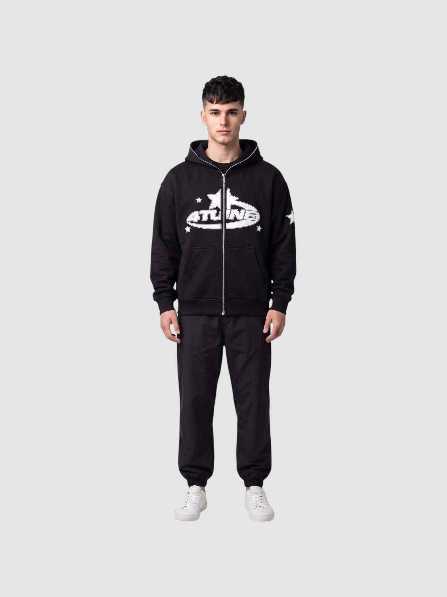 Y2K Avenue black zip-up hoodie with white star lettering and fleece lining worn by a male model