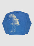 Y2K AVENUE blue oversized knit sweater featuring a cream-colored wavy face graphic in a dense polyester-acrylic blend.