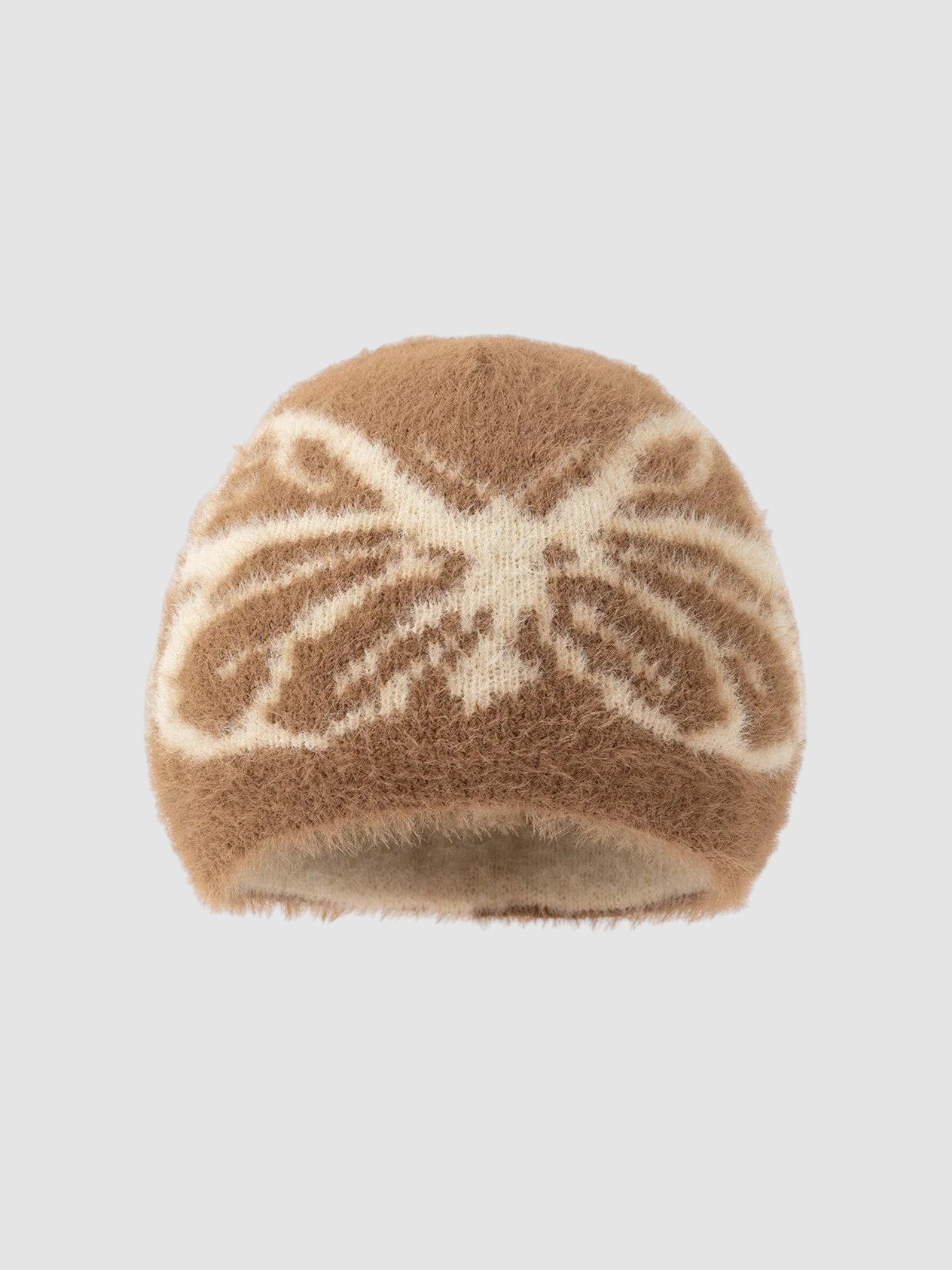 Y2K Avenue brown fuzzy beanie with a cream-colored butterfly wing pattern in a soft, plush texture.