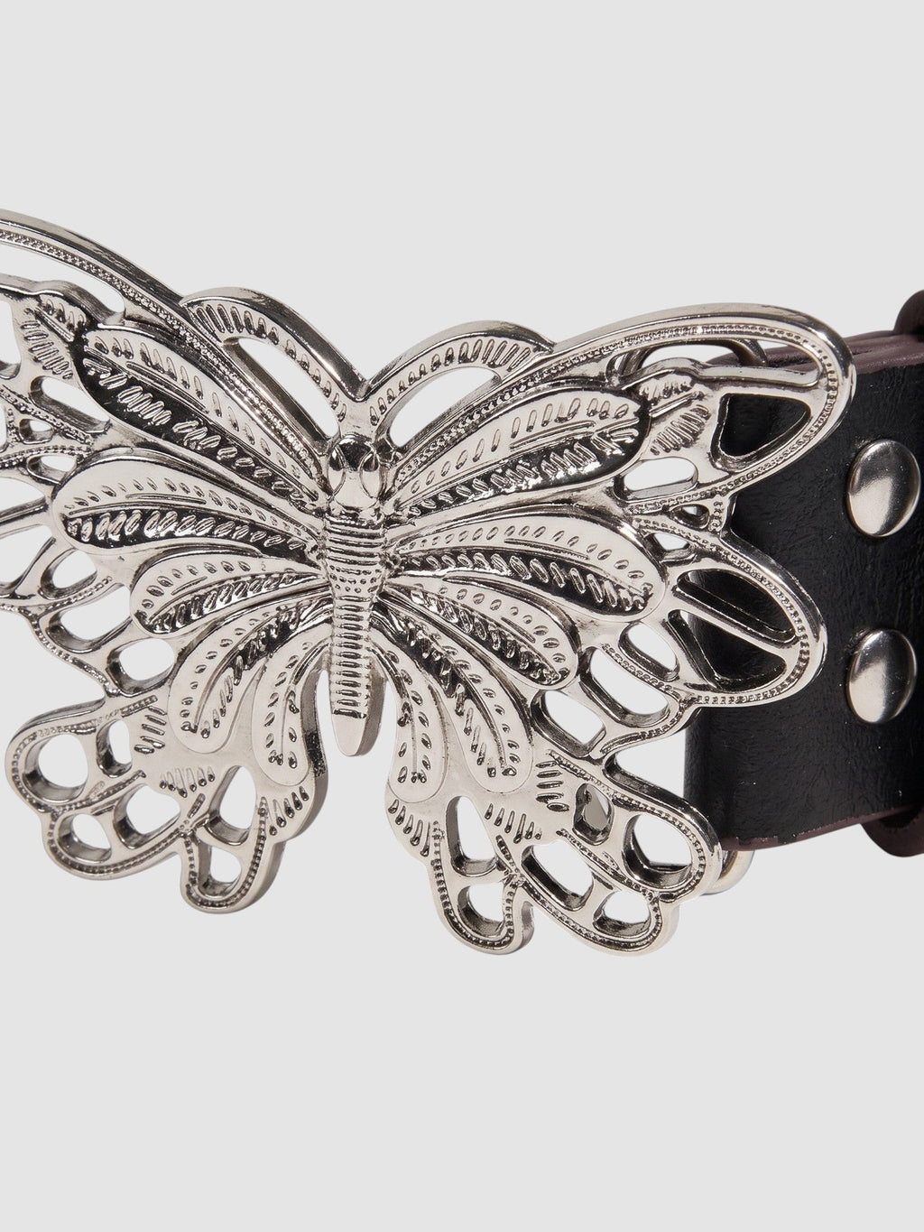 Y2K Avenue black faux leather belt featuring a detailed silver filigree butterfly buckle and metal rivets.