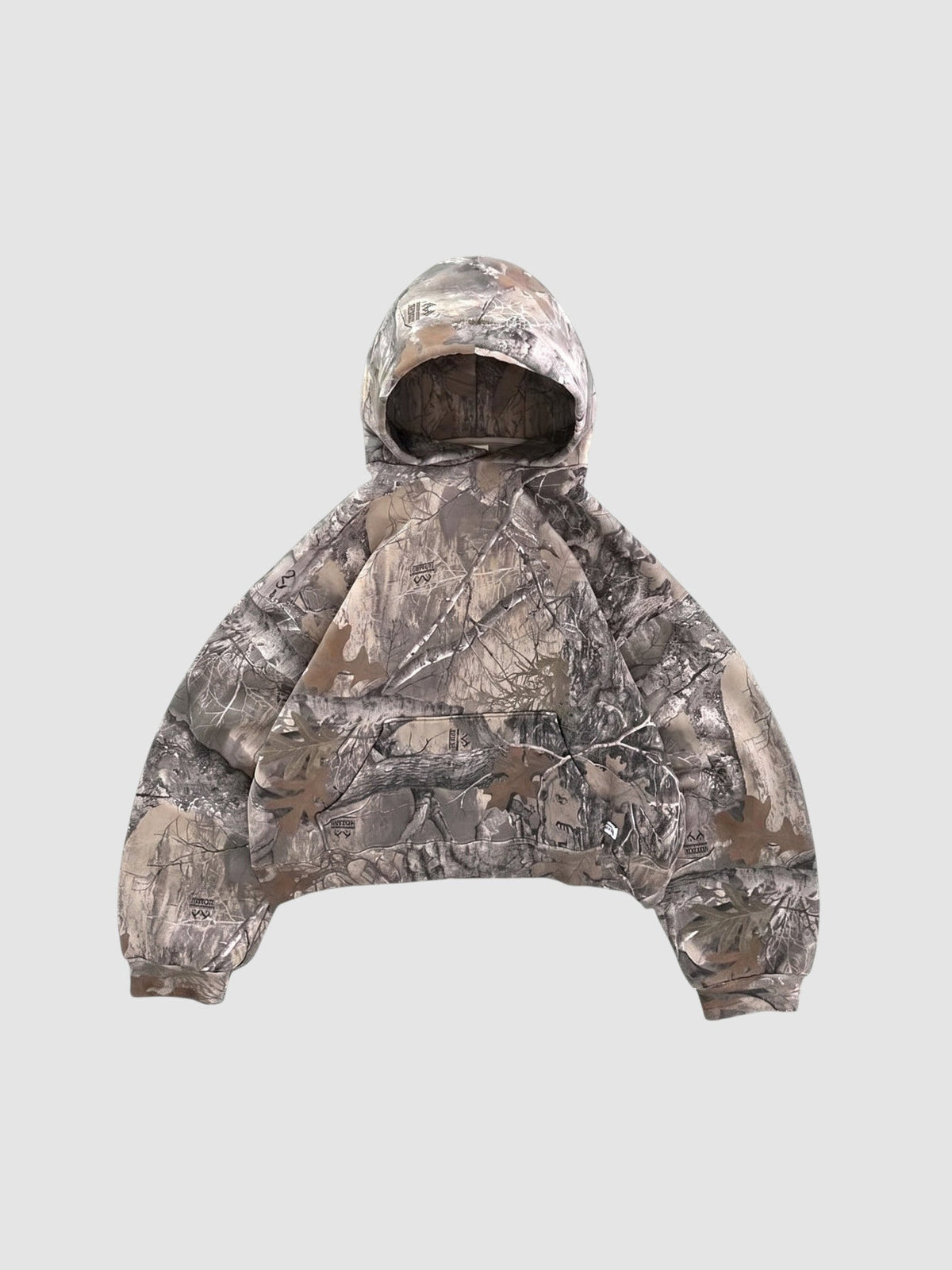 Y2K Avenue cropped boxy hoodie in a brown and grey forest camouflage print with a wide fit and ribbed cuffs