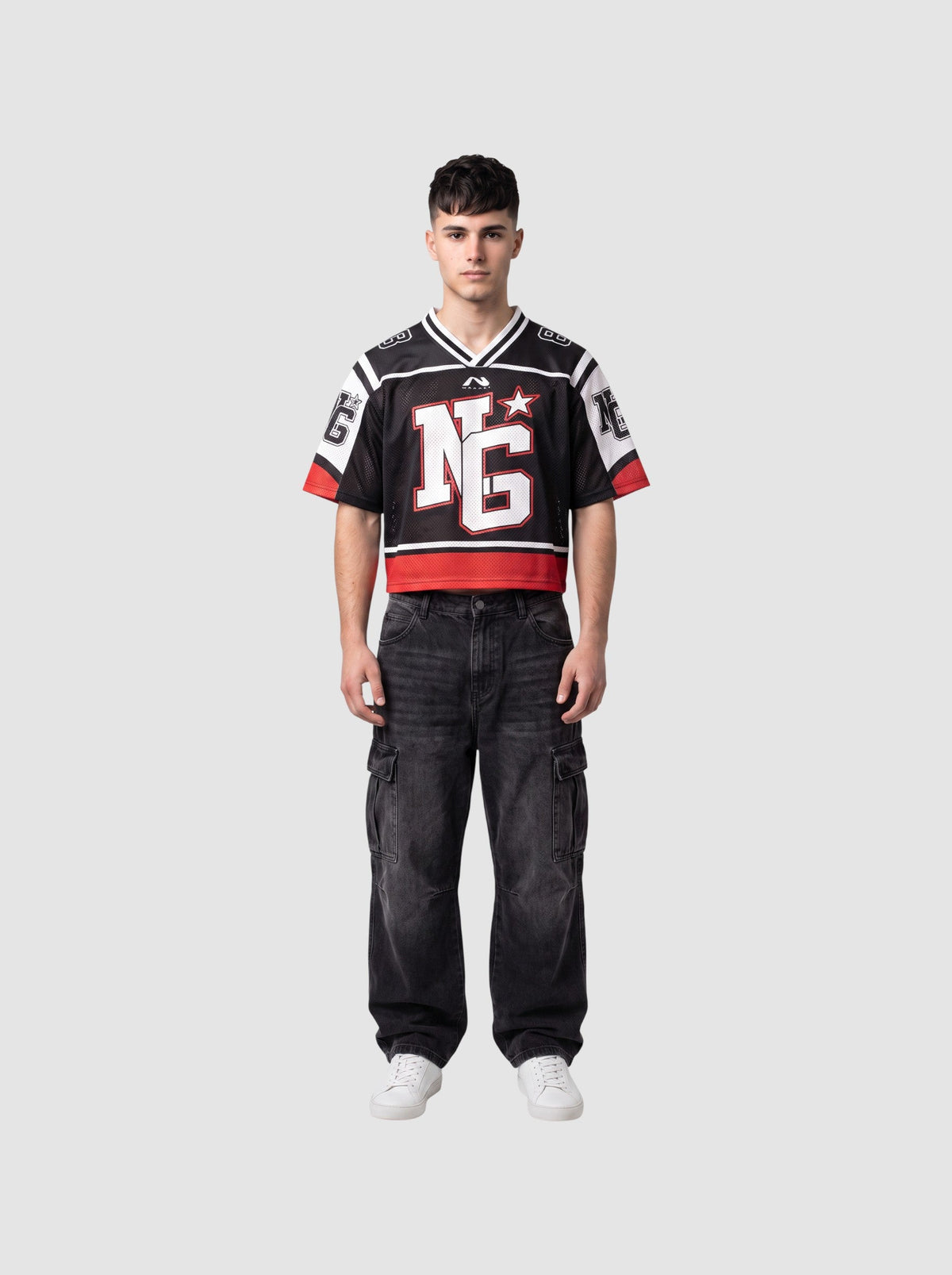 Y2K Avenue cropped black mesh football jersey with white shoulder panels, red trim, and graphic monogram on chest.