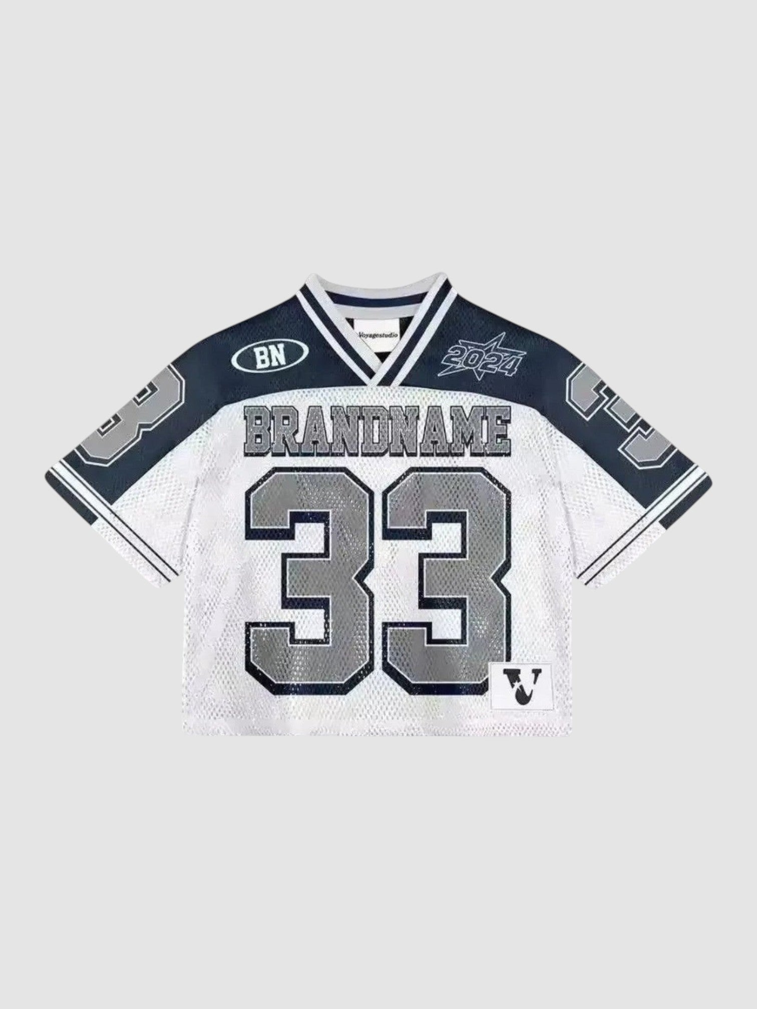 Y2K Avenue cropped mesh football jersey in white and black with number 33 print, V-neck, and sporty graphic details.