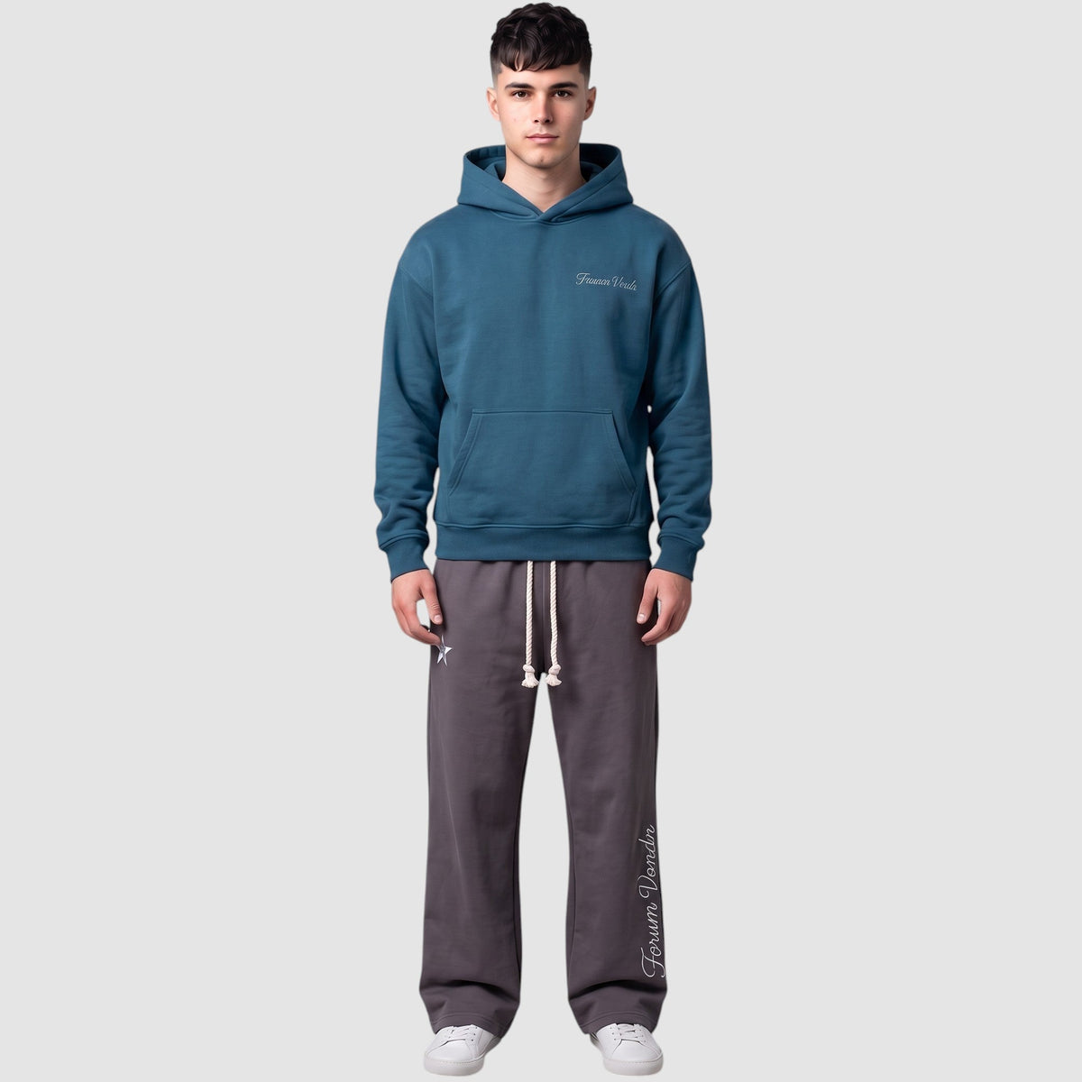 Y2K Avenue double waist grey jogging pants with gothic embroidery and braided drawstring worn by a male model