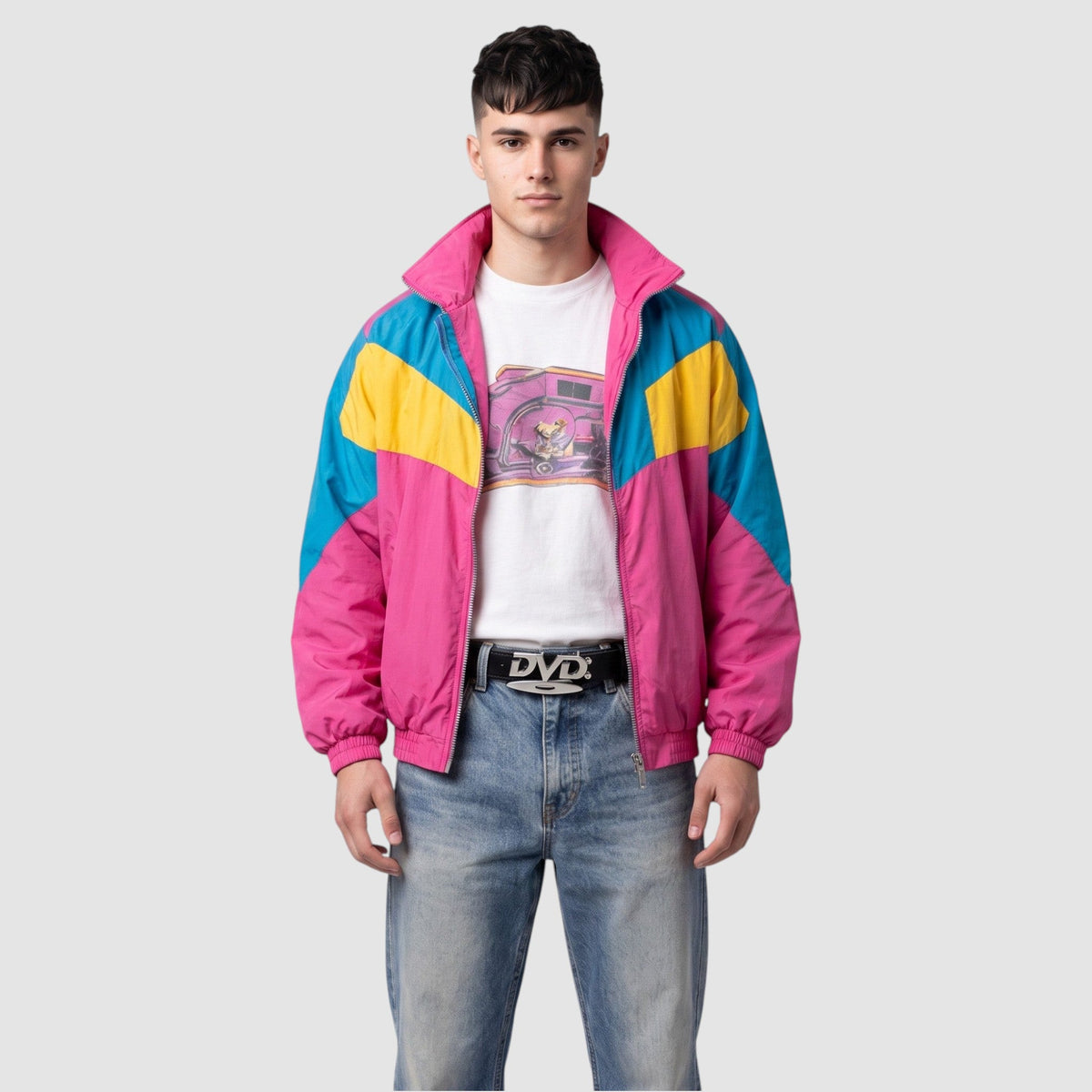 Y2K Avenue black faux leather belt with silver DVD disc buckle worn by a man in a colorful retro windbreaker