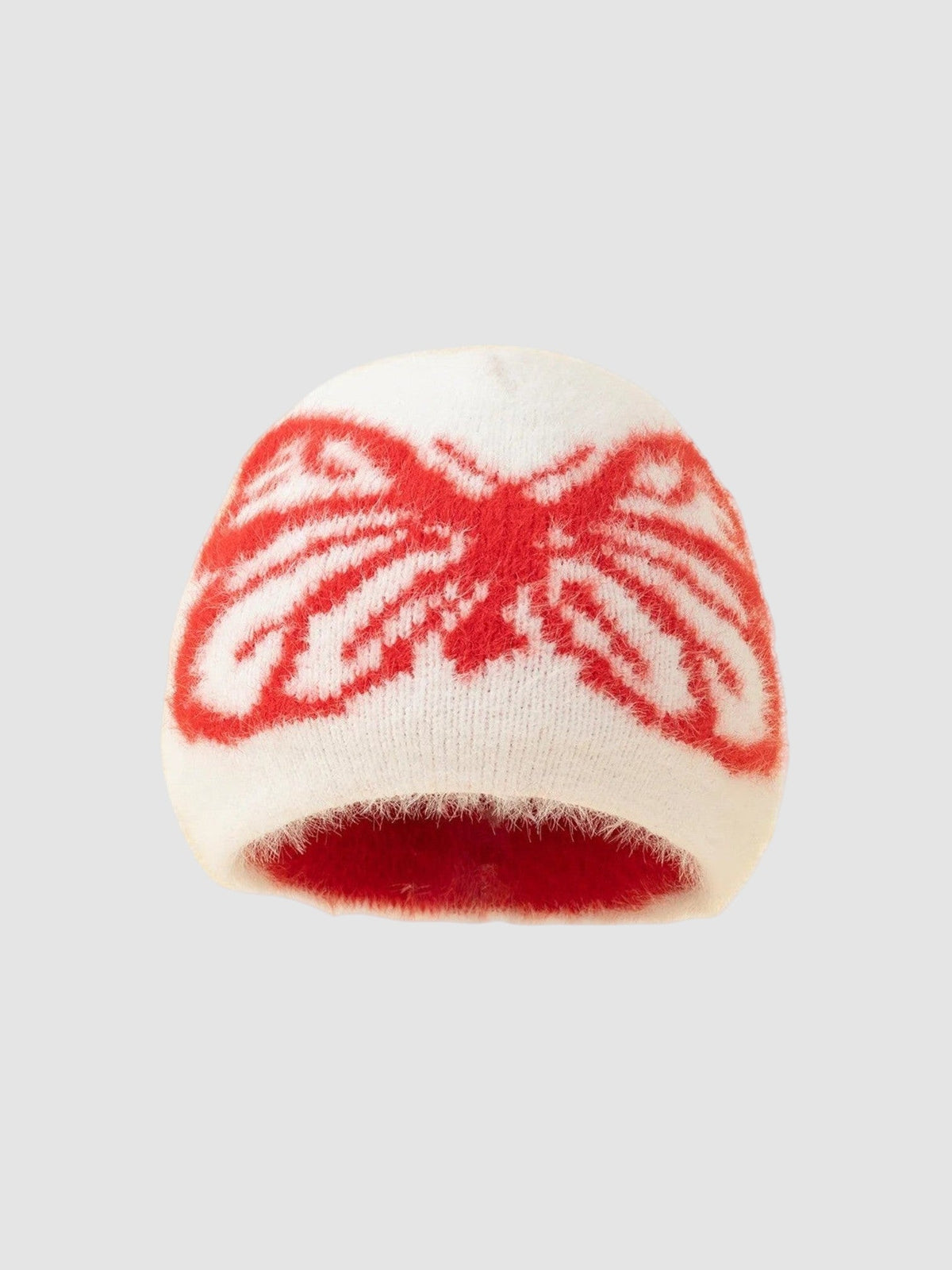 Y2K Avenue fluffy white beanie featuring a bold red butterfly wing pattern in a soft, fuzzy knit texture.